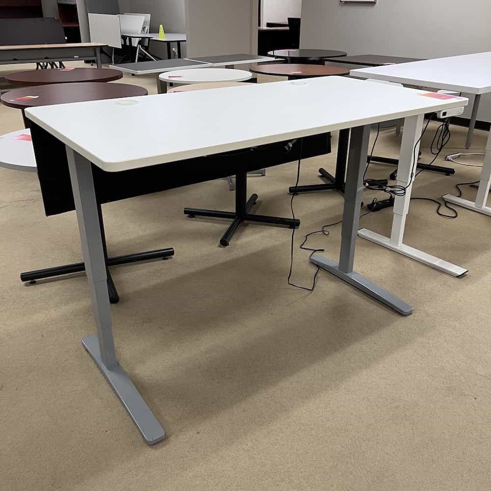 white uplift desk with black mesh privacy panel