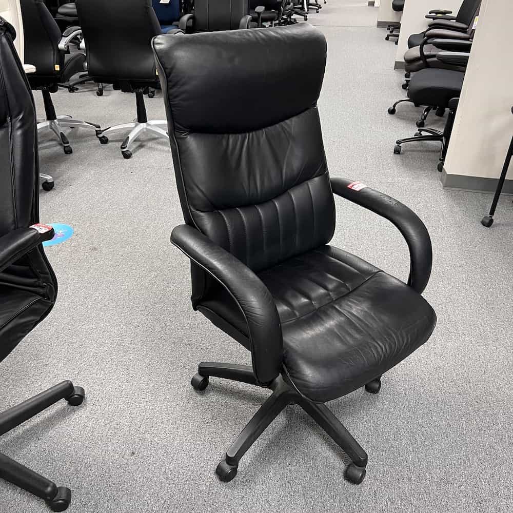 black leather high back conference chair fixed arms, front