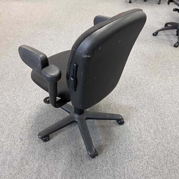 black steelcase drive, arms twisted, back view