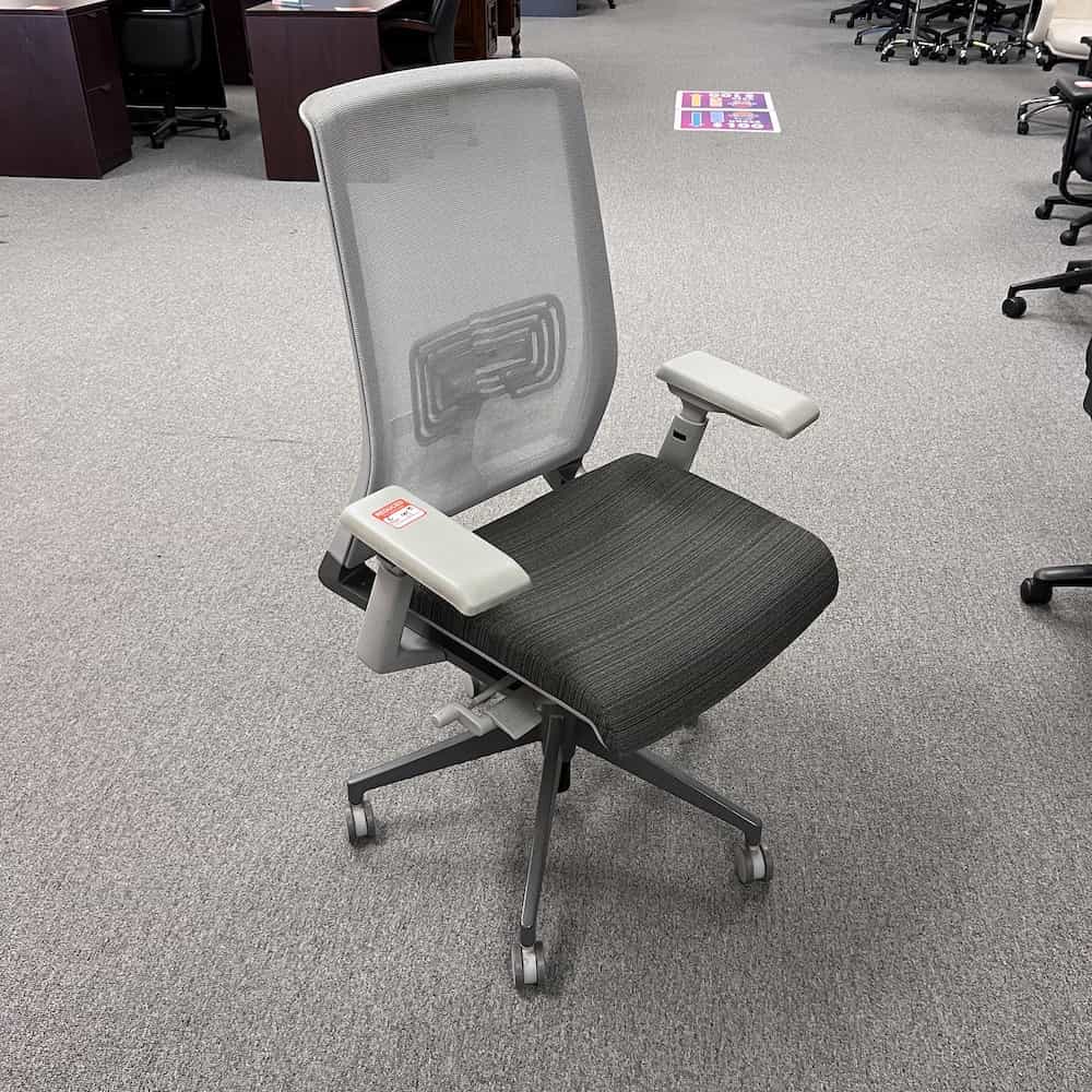 grey haworth very mesh task chair, mesh back, grey stripe upholstered seat