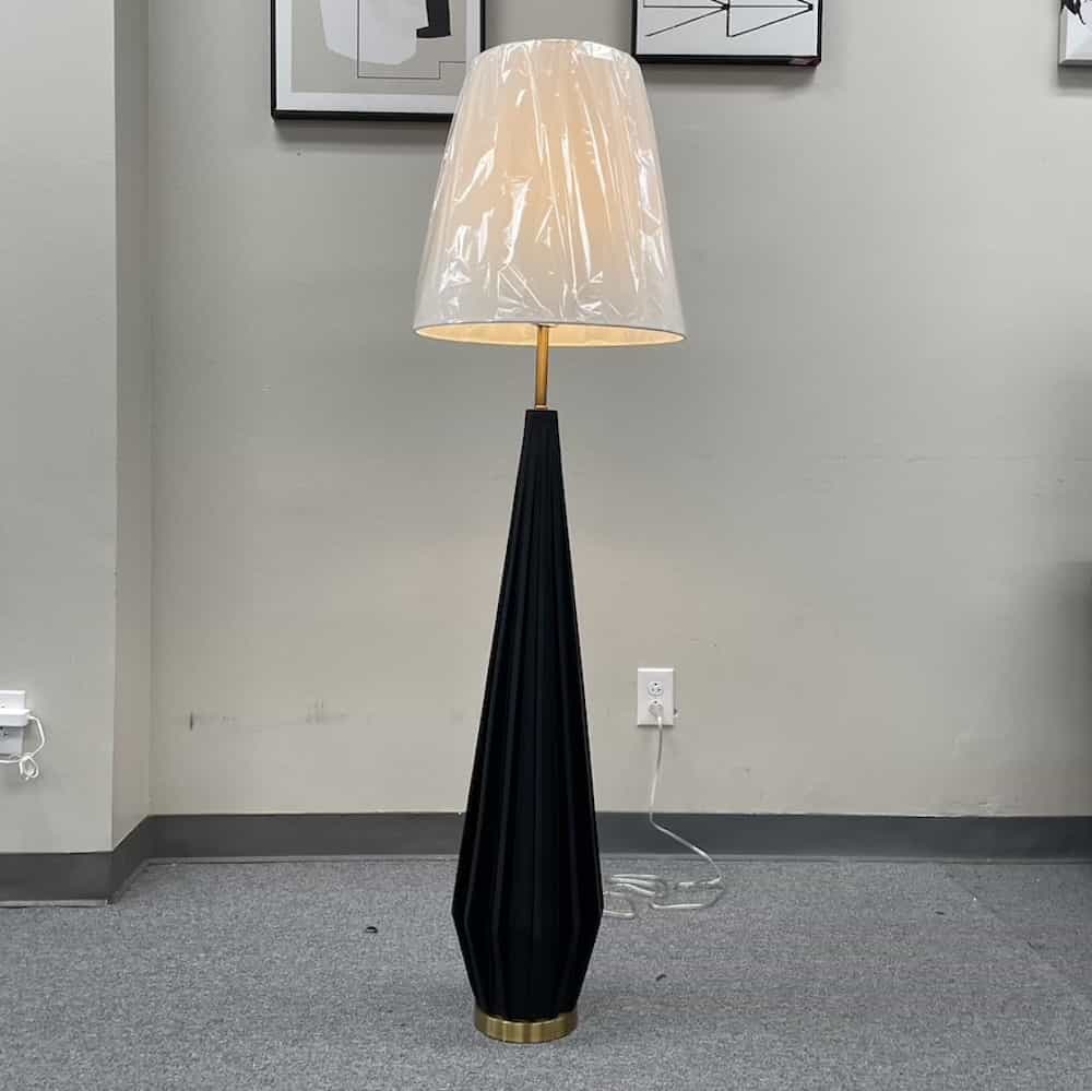 black rocket shaped "umbrella" lamp with black base and white top
