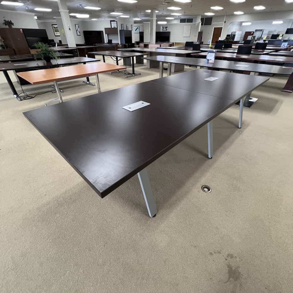 espresso rectangle conference table with angled silver legs, 3 sets of legs, silver chord port holes