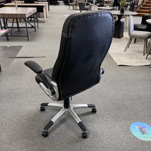black flip arm executive chair, back view