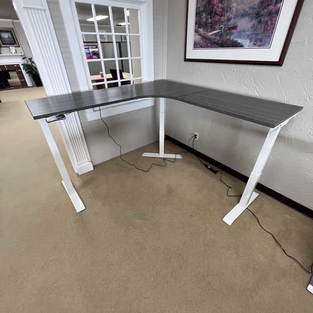 height adjustable, programmable l-desk with grey top and white legs