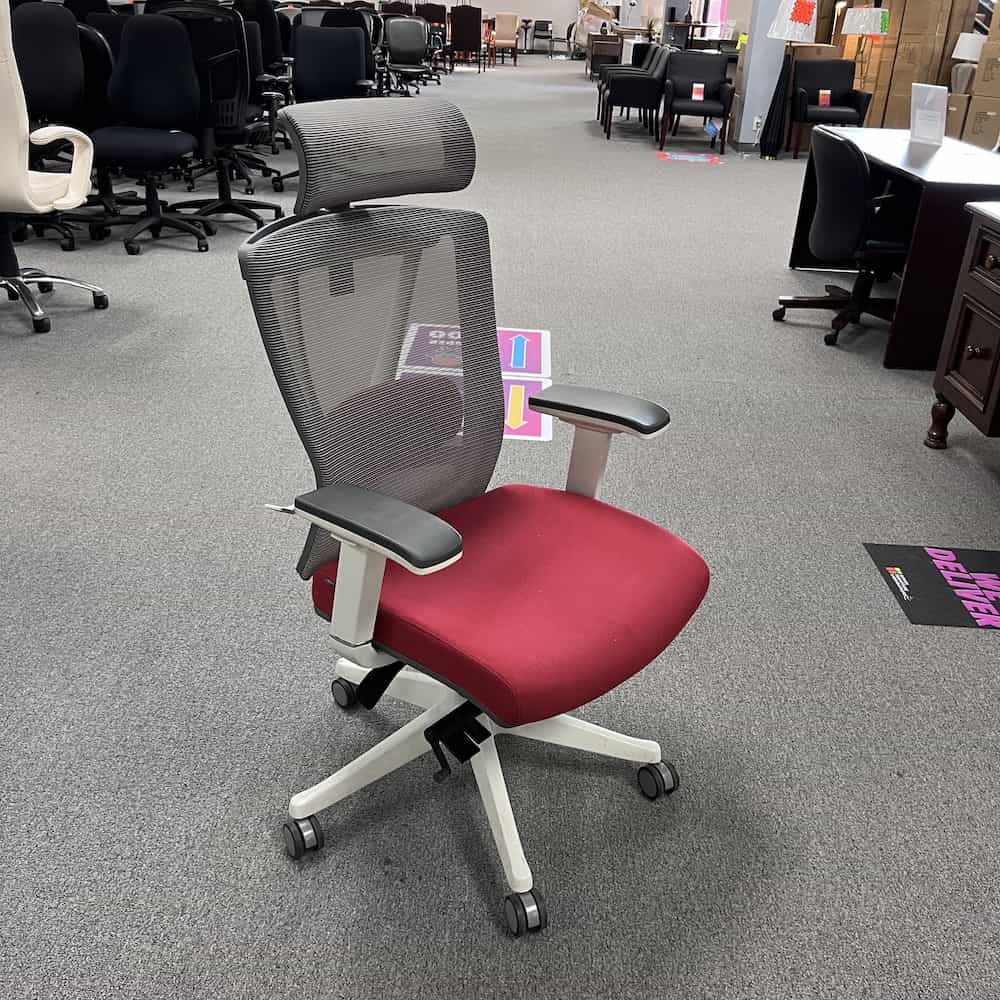 red autonomous ergonomic chair with grey mesh back and a headrest