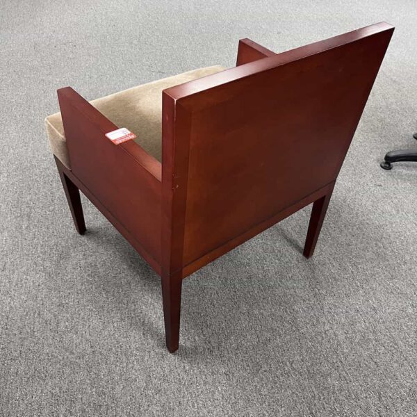 cherry veneer chair frame in a box around the back, velvet like tan mohair seat upholstery, back view