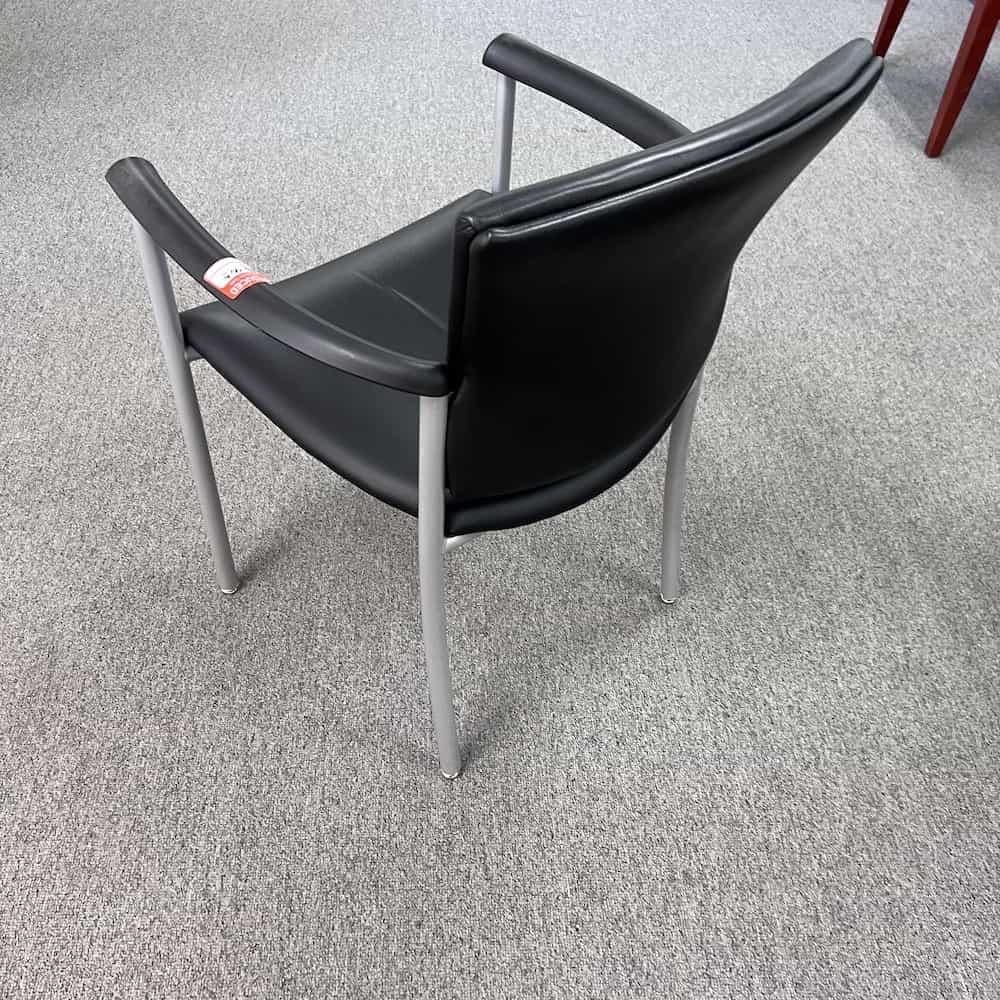 black vinyl guest chair with grey silver arms, back