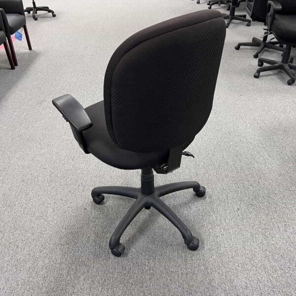 black task chair, rolling with adjustable arms, back view