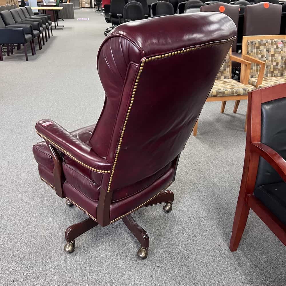 red leather vintage plush executive chair with leather arms, swivel, high back, back view