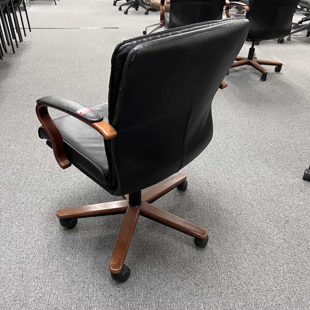 brayton executive locosta open arm couture conference chair with black leather seat and mahogany base, back view