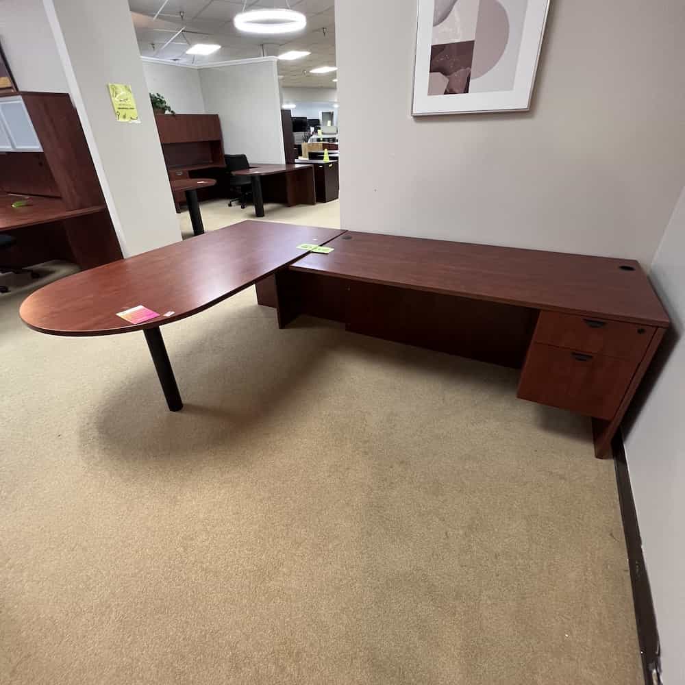 cherry laminate l-desk with extra large right return, one hanging box file on return, bullet nose for main desk