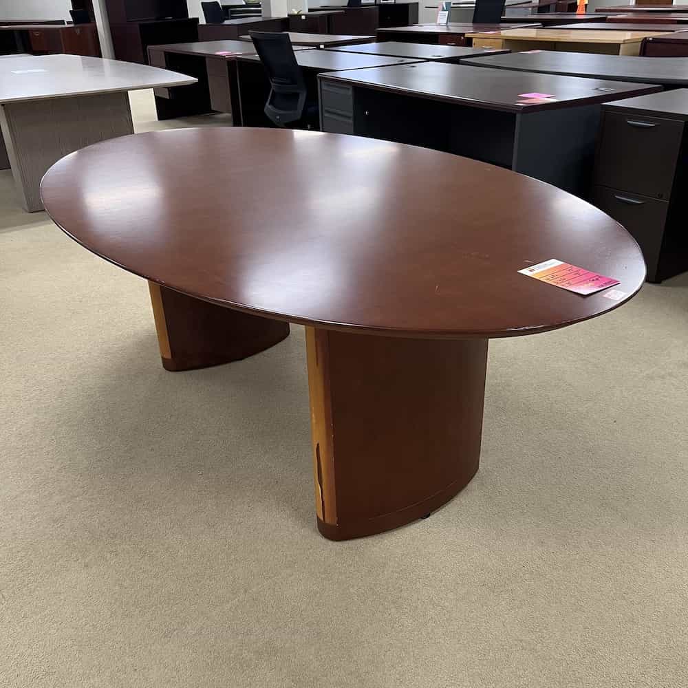 cherry oval conference table with damaged oblique base, veneer wood