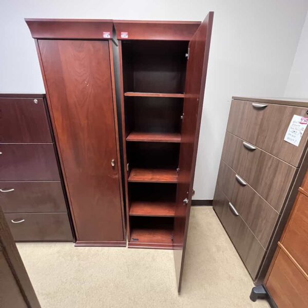cherry veneer storage wardrobe cabinet, crown molding on top, open on one of them on the right