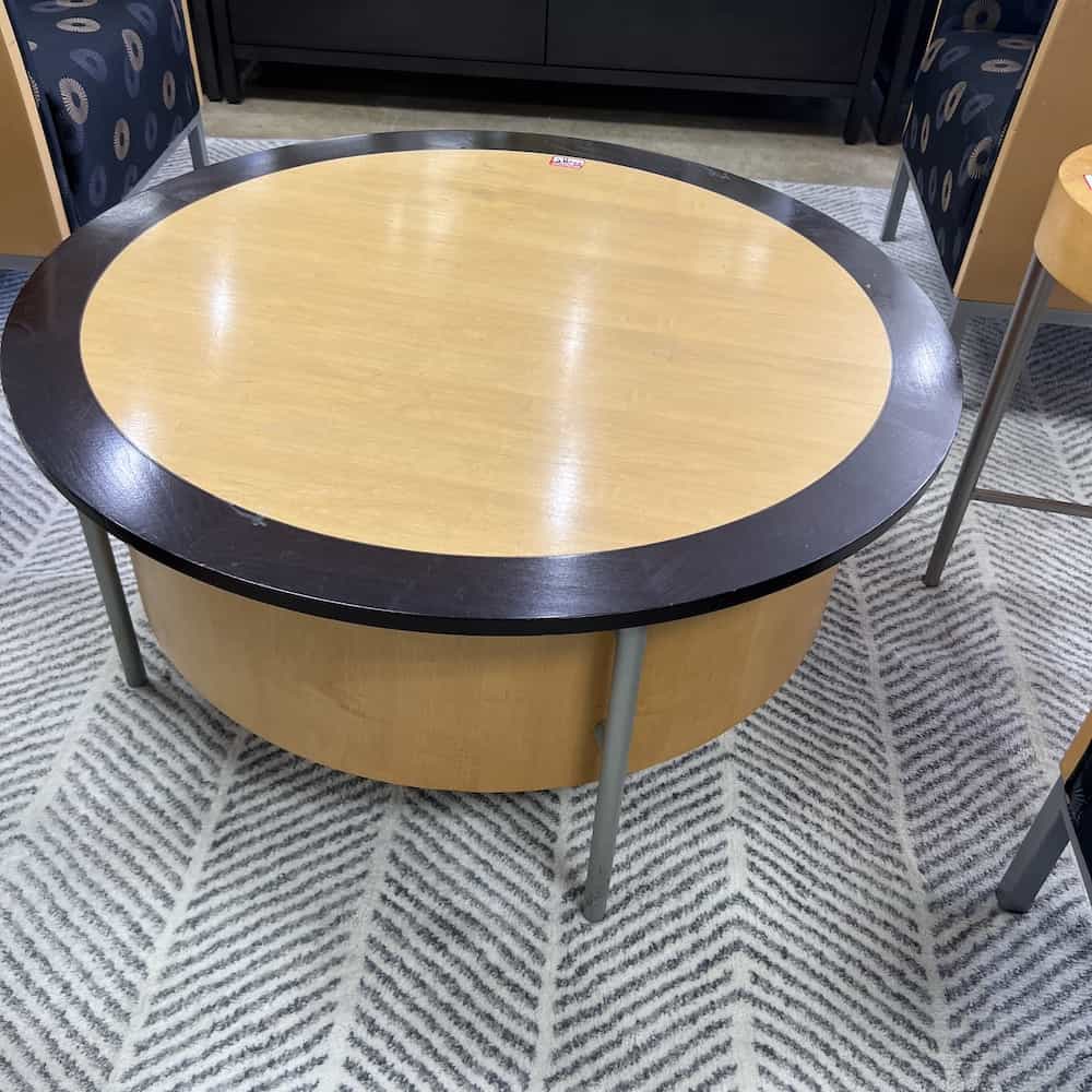 maple circle coffee table, modern with black outline edging, 3 silver metal legs