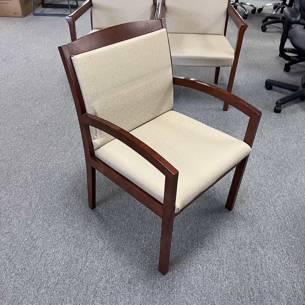 cream seat and mahogany frame guest chair, front view
