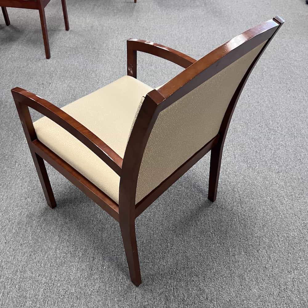 cream seat and mahogany frame guest chair, back view