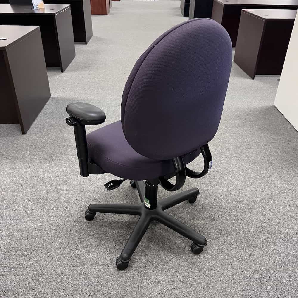 purple upholstered steelcase criterion plus office chair, rounded egg-like back, back of chair view