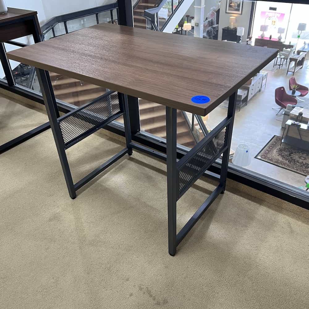 small desk, grey metal industrial base, walnut laminate top, hangs off the side a bit