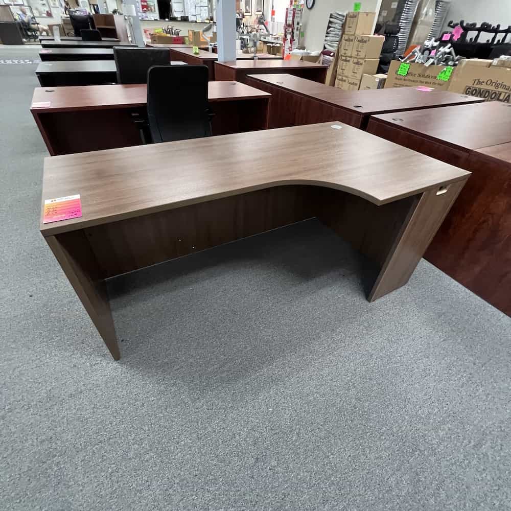 walnut laminate l-desk, pork chop shape, straight front, no drawers