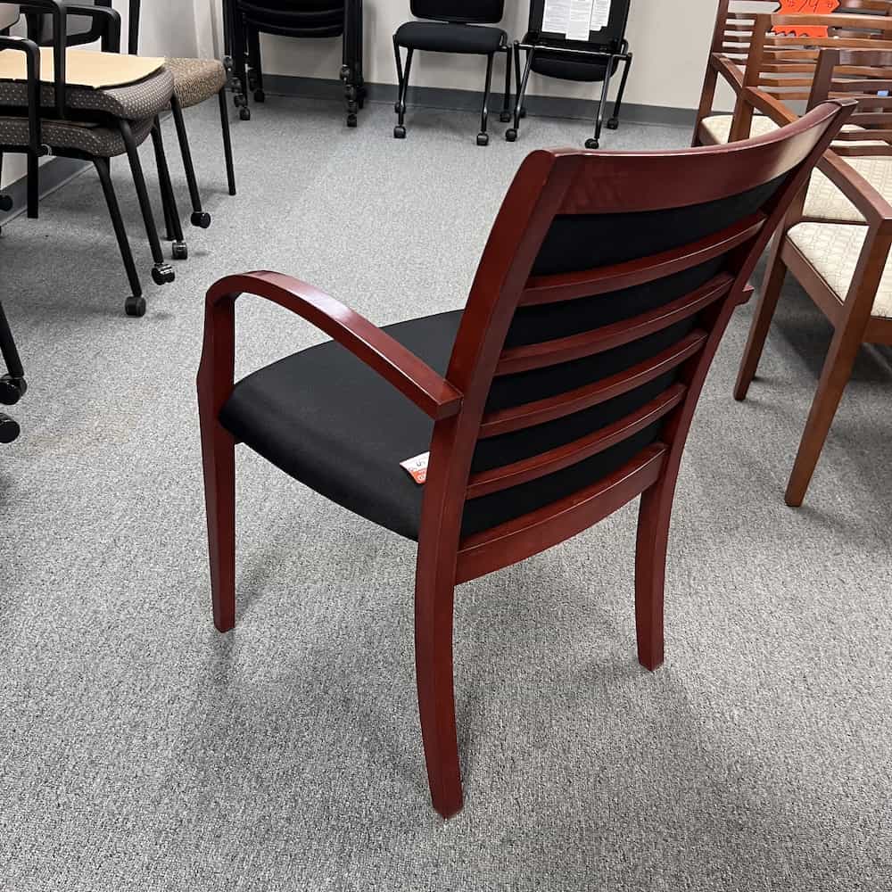 black upholstered seat with cherry veneer arms and ladder back