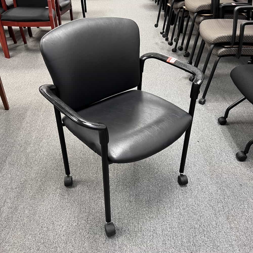 hon brand black vinyl stacking chair with arms, rolling