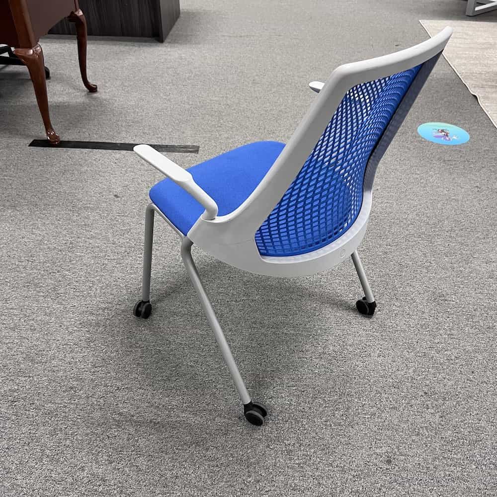 blue seat and elastometer back sayl rolling chair with arms, back view