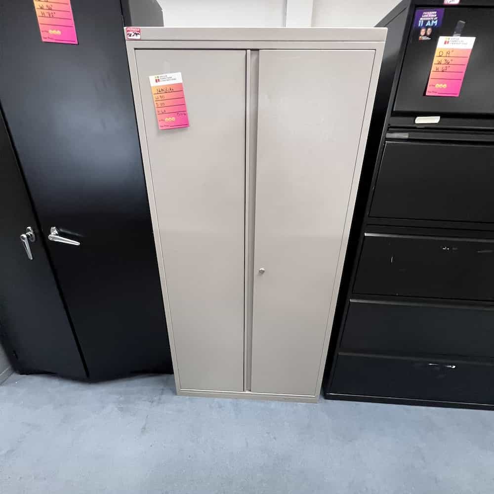 grey two door metal storage cabinet with shelves, meridian brand