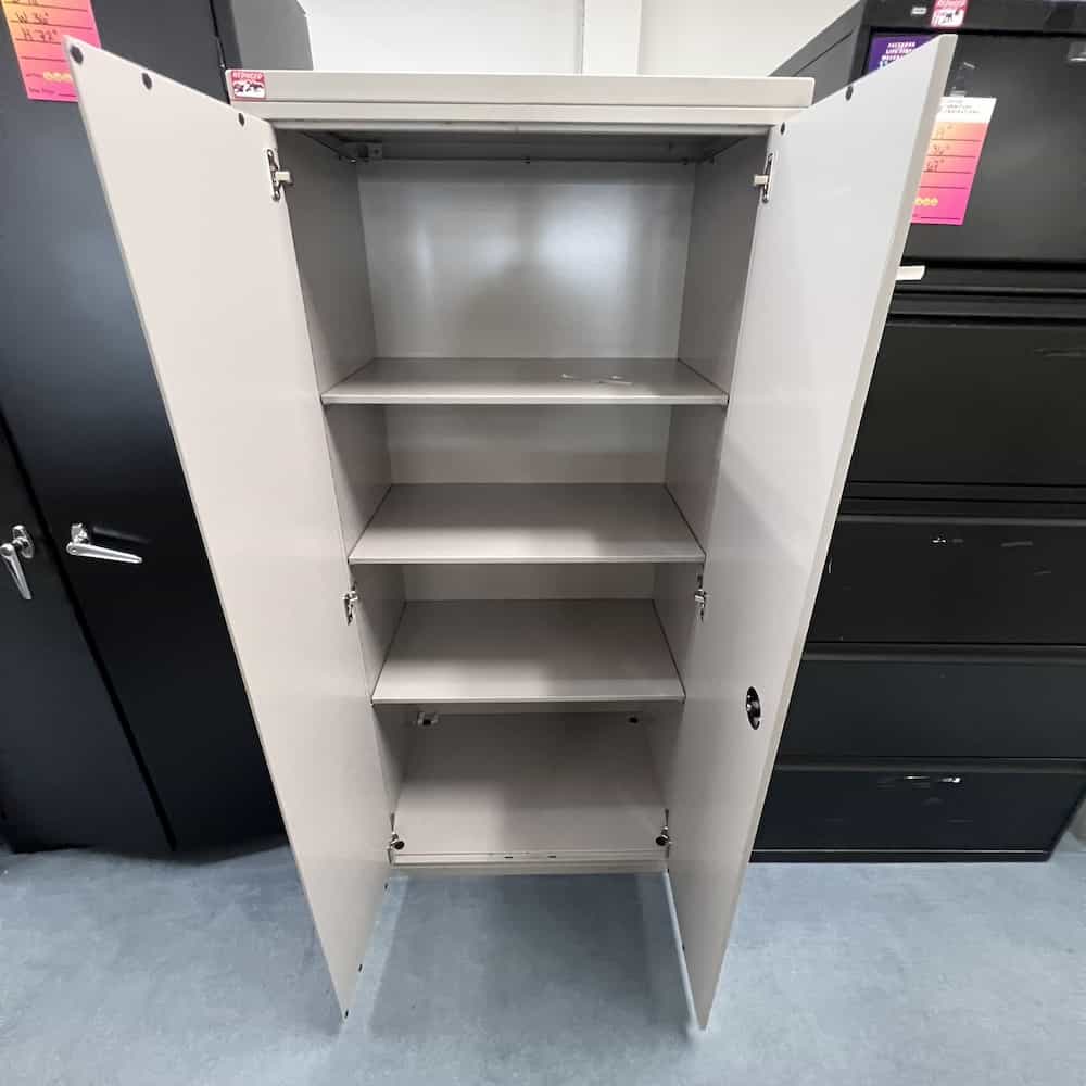 grey two door metal storage cabinet with shelves, meridian brand, open doors