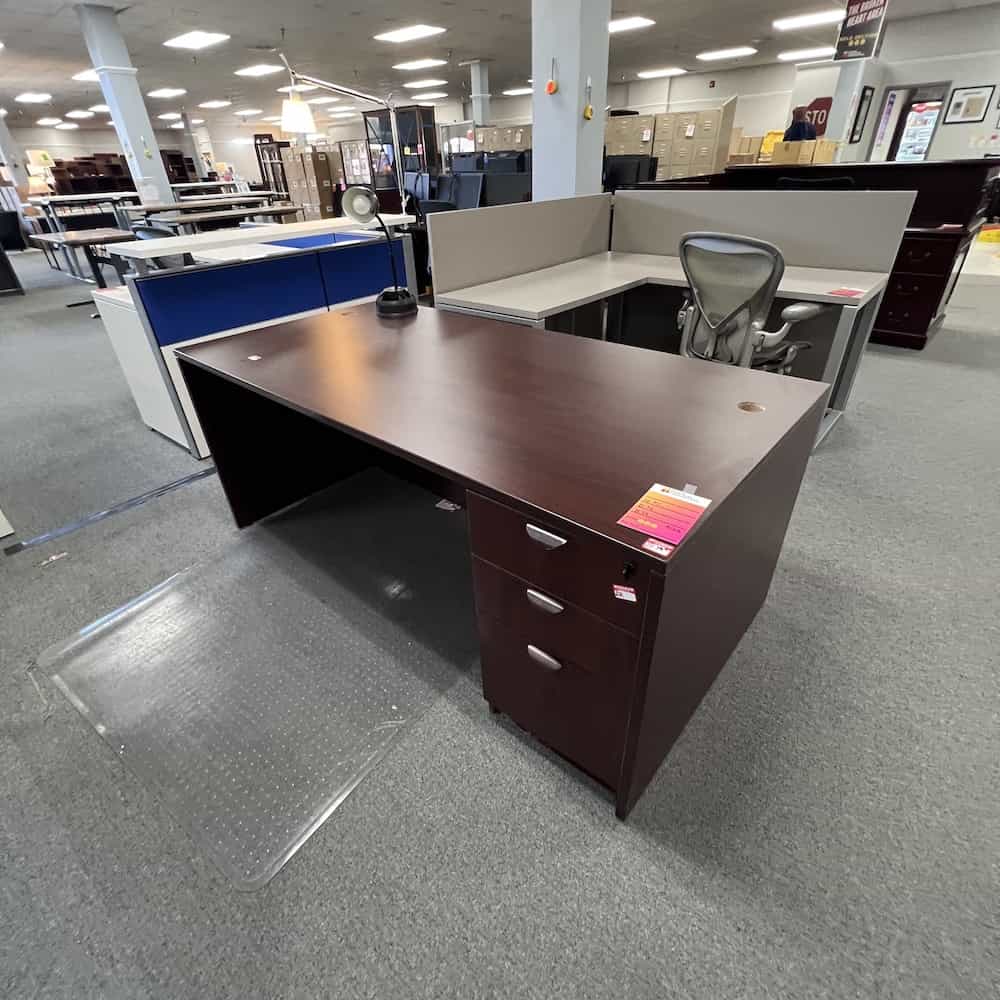 mahogany desk 71x36 with one pedestal box box file on the right, silver pulls