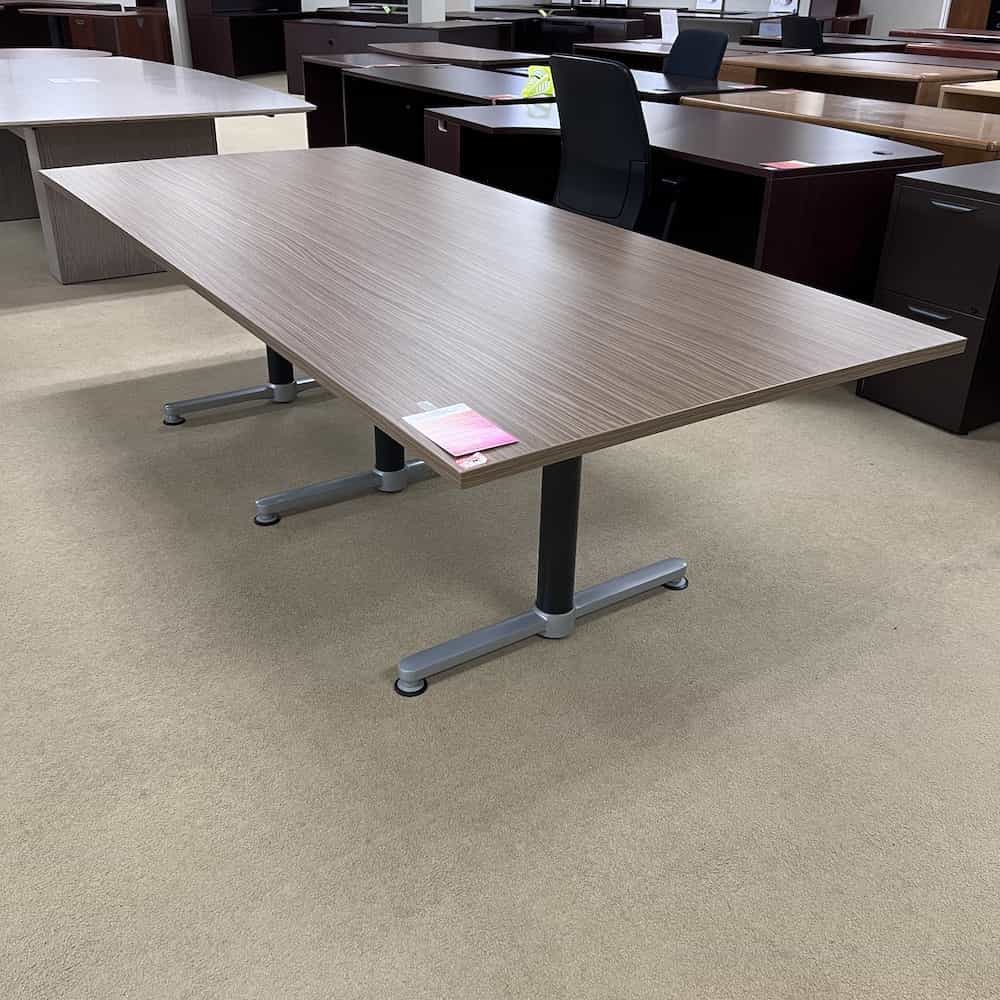 walnut top rectangle laminate conference table with black legs and silver feet