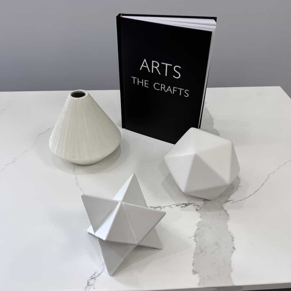 decor set of ceramic shapes in white, black book of arts