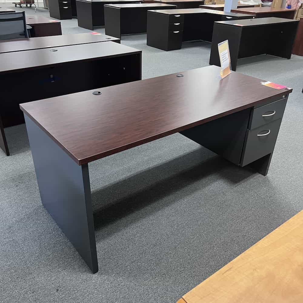 mahogany laminate top desk, metal grey base with one hanging box file on the right