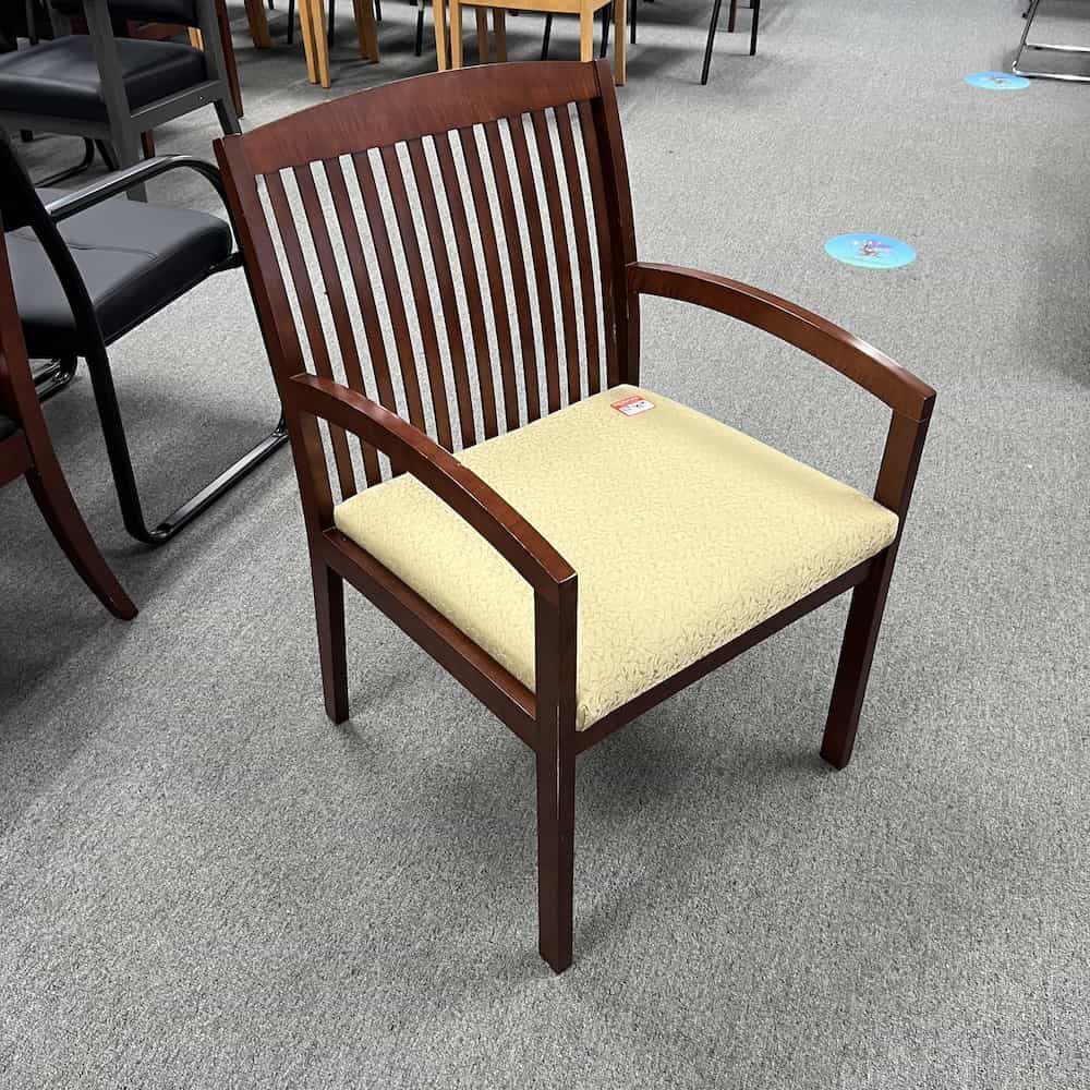 Beige upholstery and mahogany veneer wood frame chair