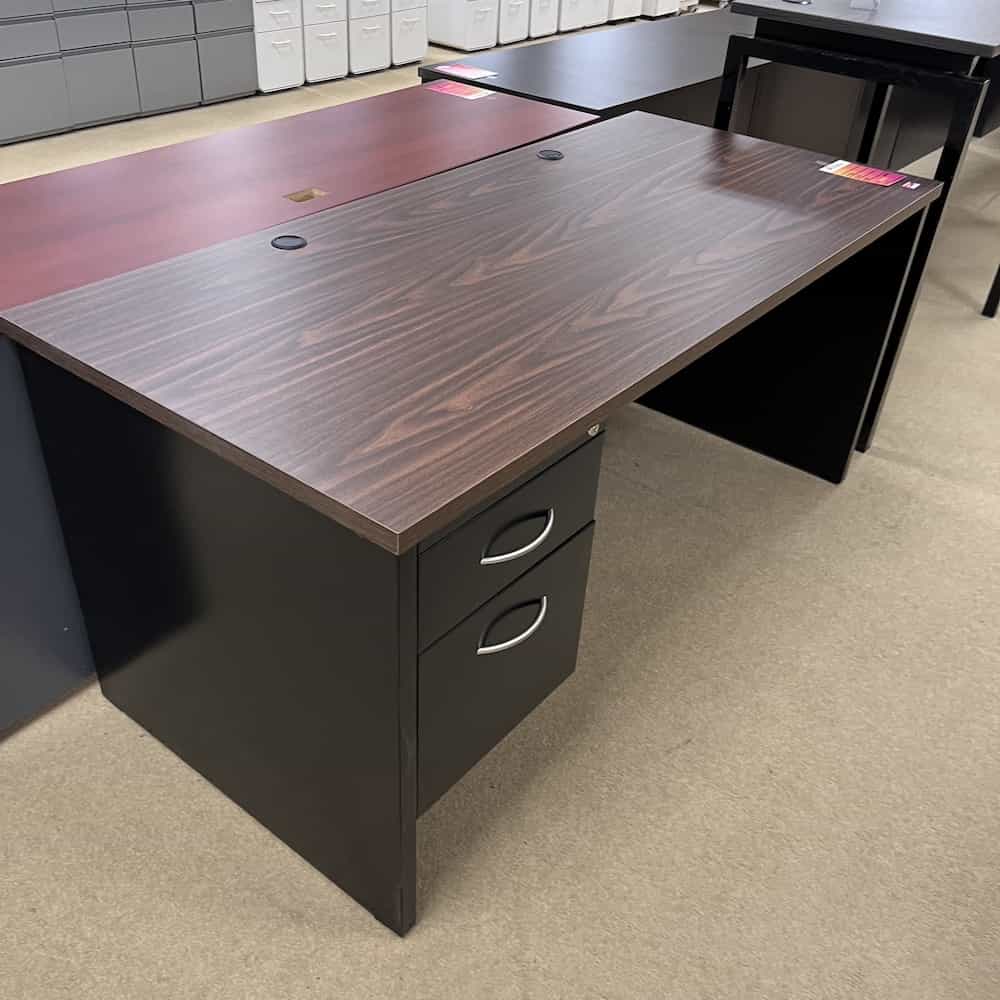 walnut laminate top and black metal desk with box file on the left