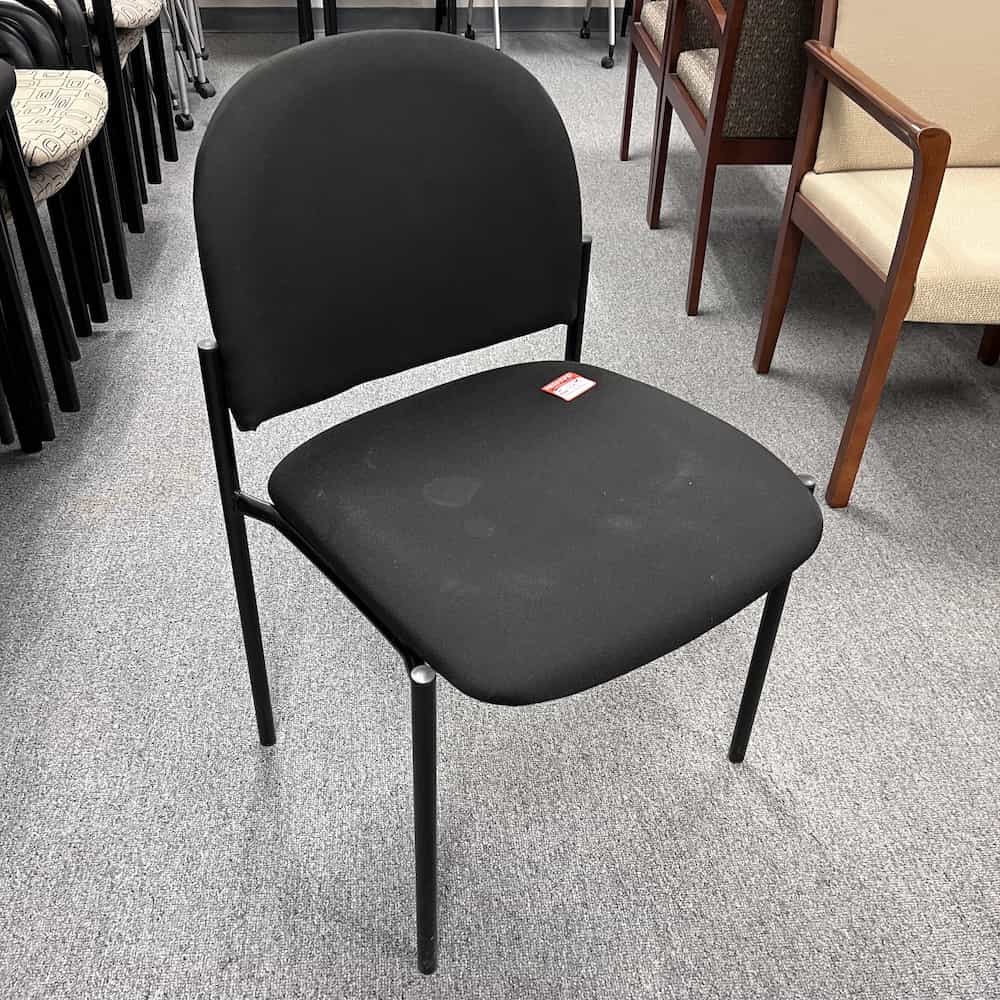 black upholstered stacking chair