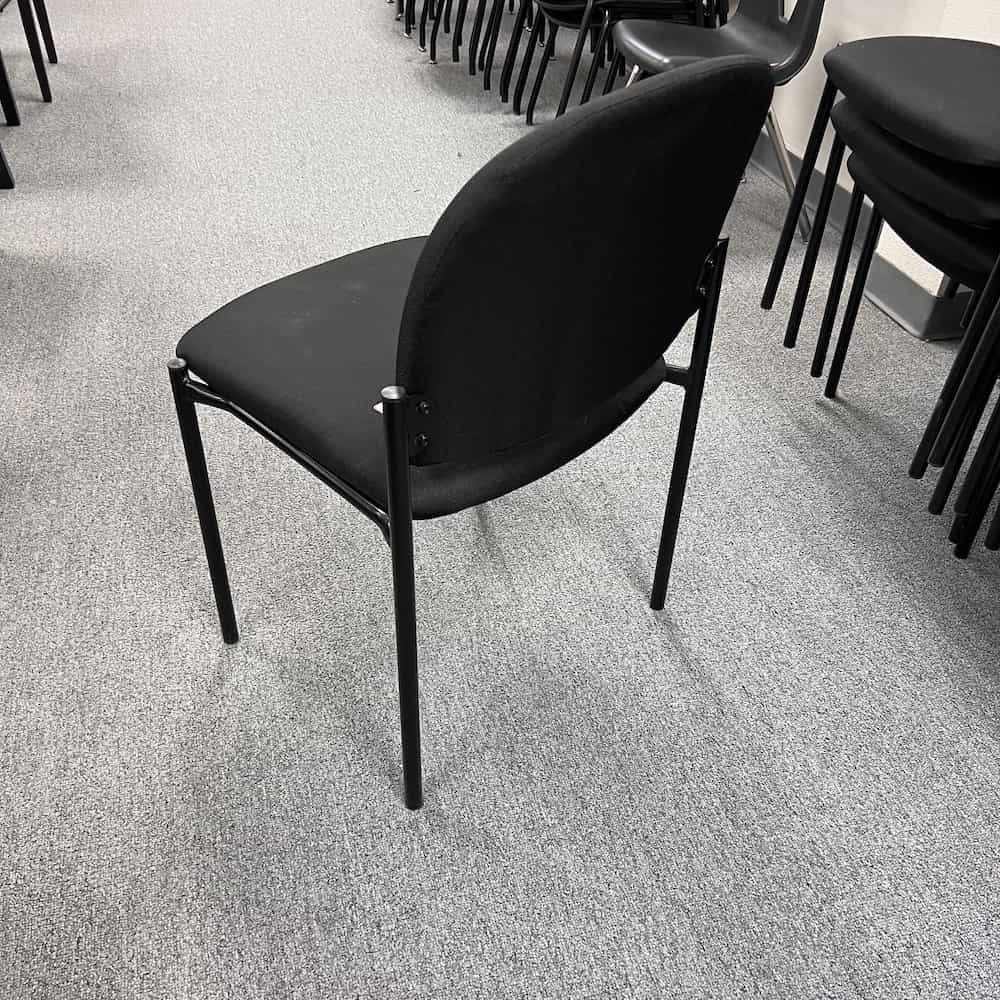 black upholstered stacking chair