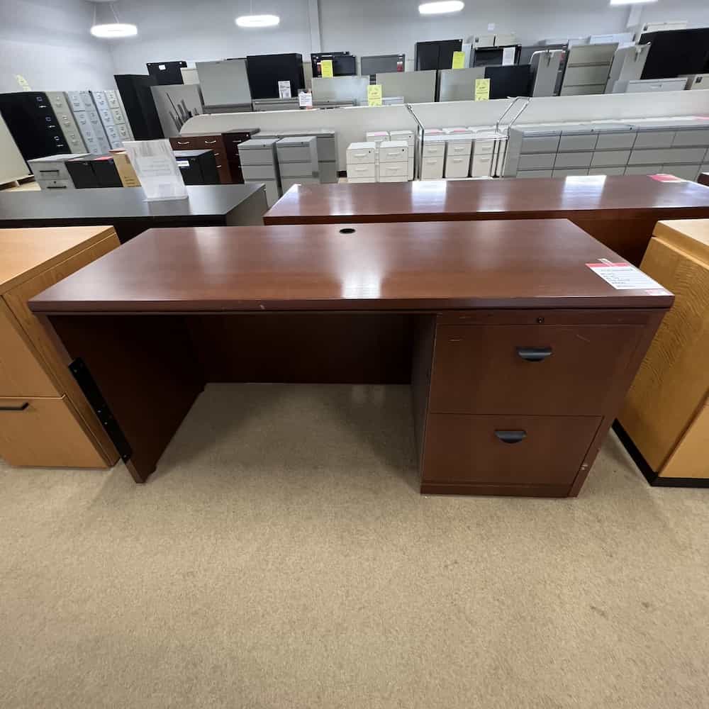 cherry veneer desk with one file file on right side