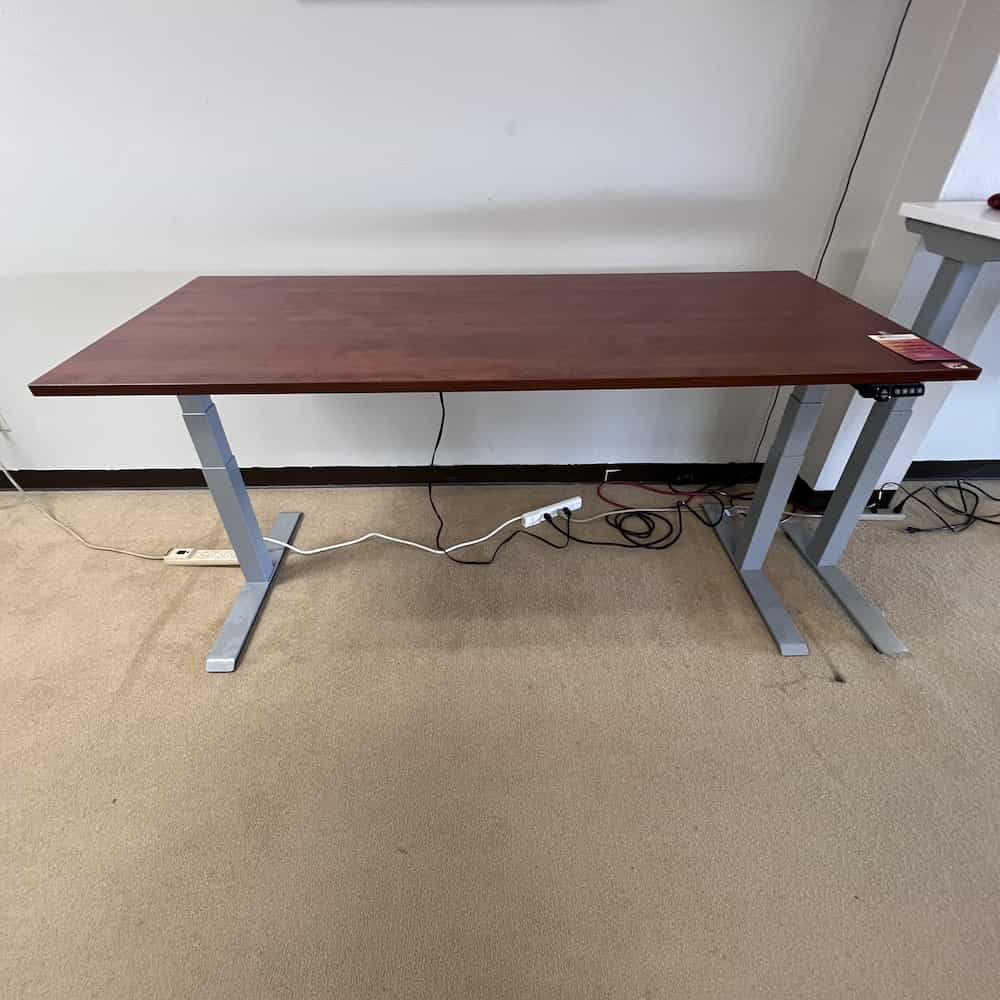 cherry laminate topped height adjustable desk with silver metal clear design brand base