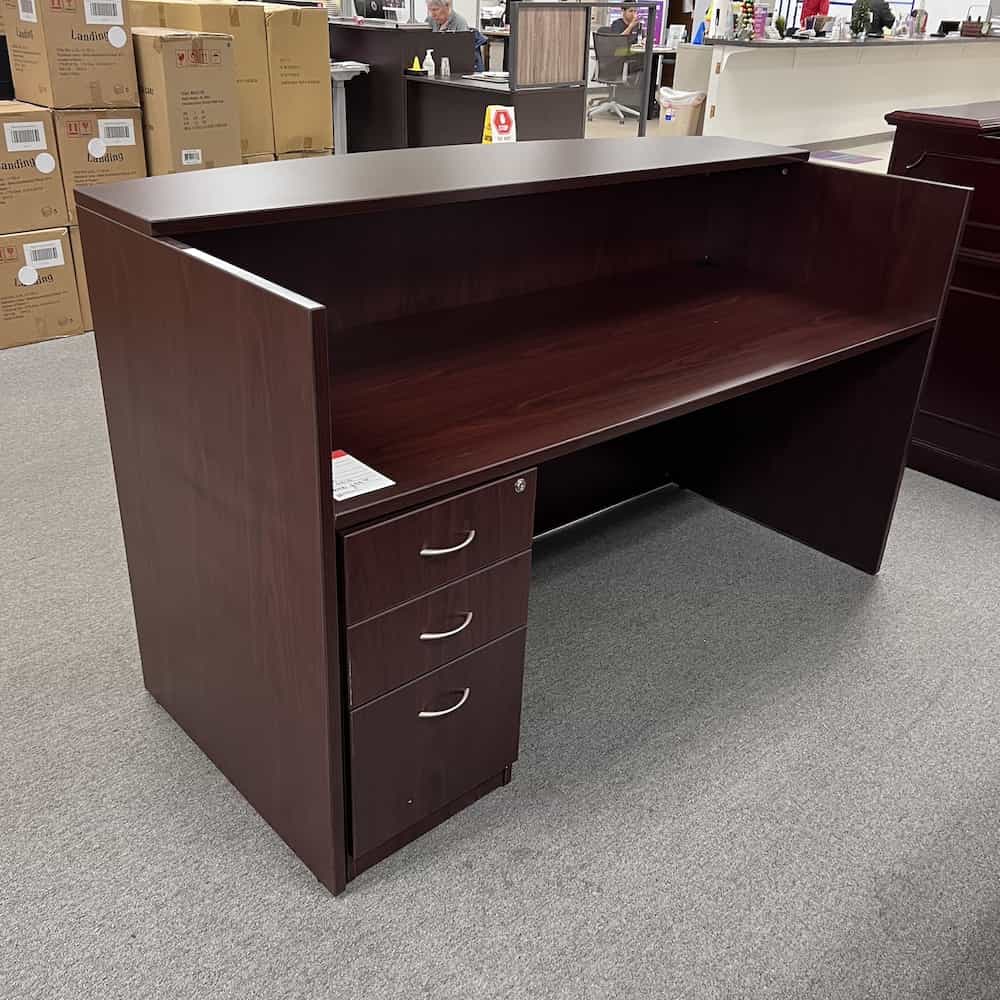 mahogany reception desk with laminate transaction top and one box box file pedestal