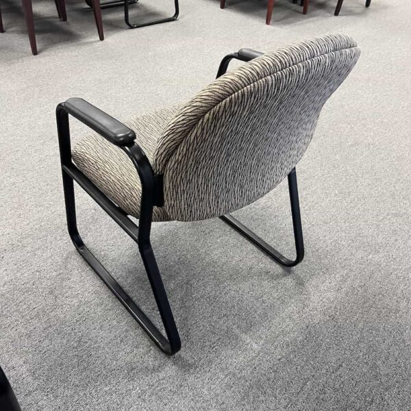 tan guest chair with black metal base