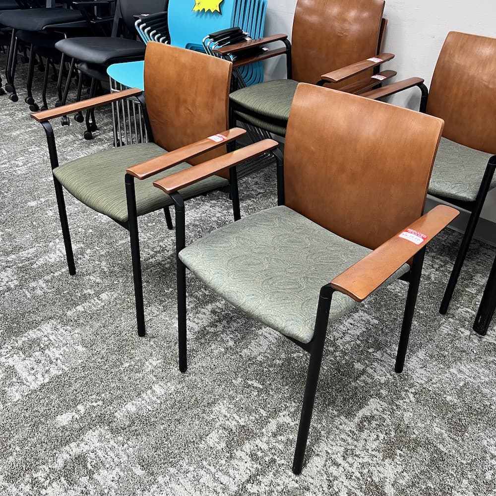 cherry veneer wood arms and back, green upholstery seat, stacking