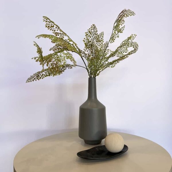 grey ceramic vase, dark grey plate and taupe ceramic ball