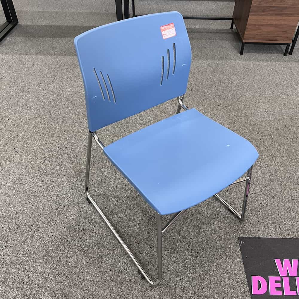 blue plastic cafeteria stacking chair with chrome legs