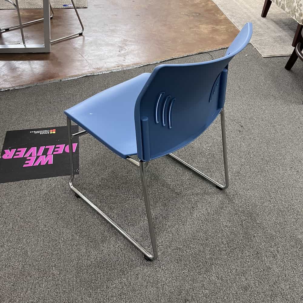 blue plastic cafeteria stacking chair with chrome legs