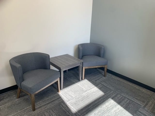 new grey reception room 2 lounge chairs with side table