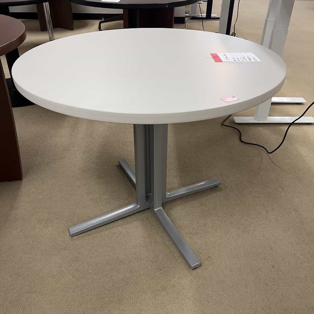 light grey laminate round table with grey metal x base