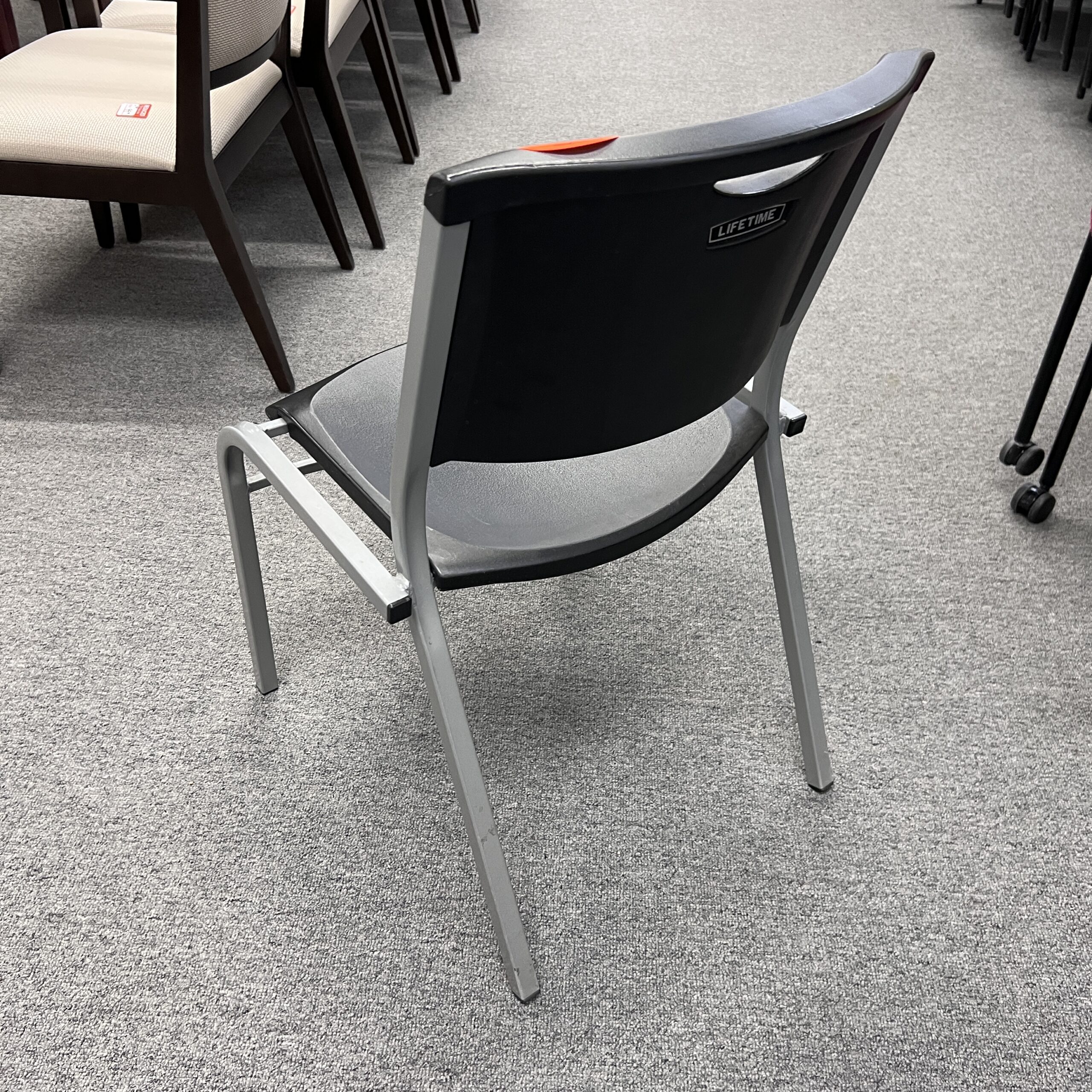 black plastic stacking chair with grey silver frame lifetime
