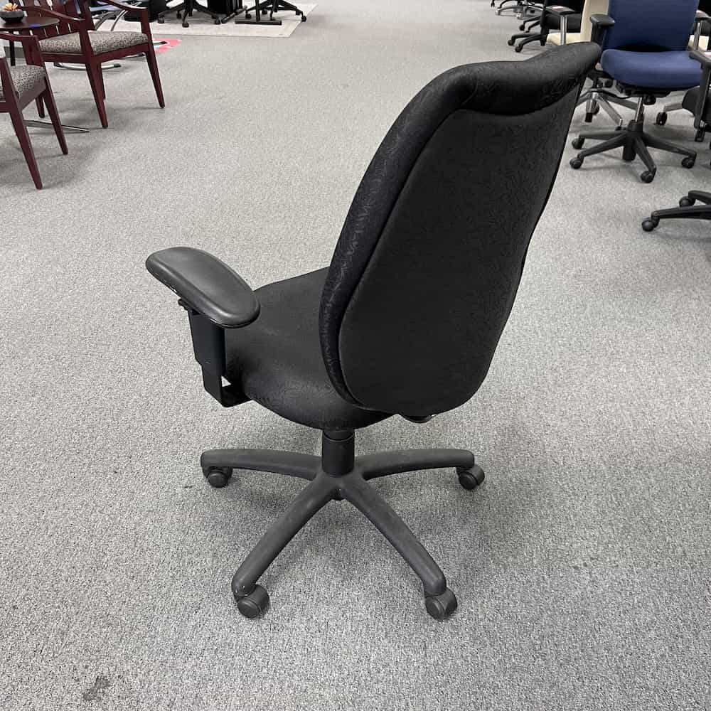 black task chair with black upholstered back