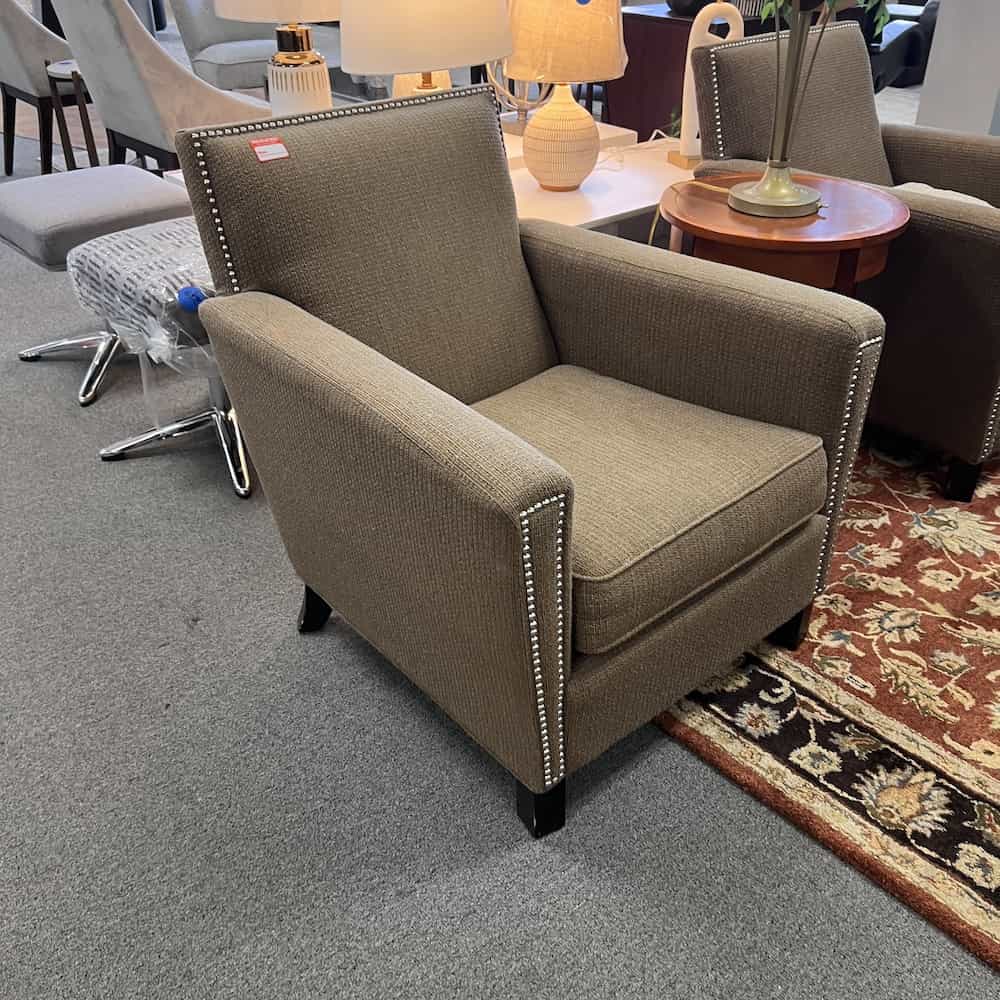 grey and brown upholstered arm chair with silver nailhead trim used hotel furniture