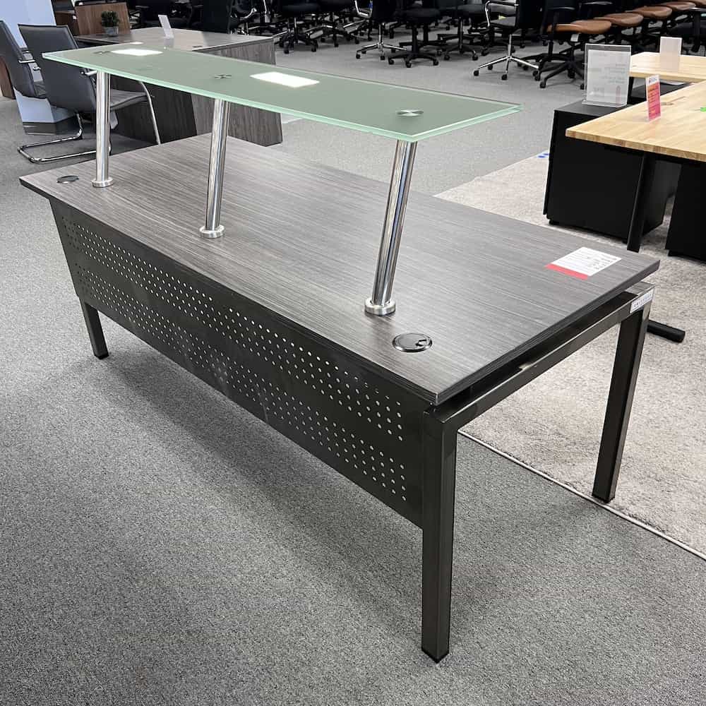 grey laminate desk with silver metal legs and privacy panel and tempered glass shelf transaction top